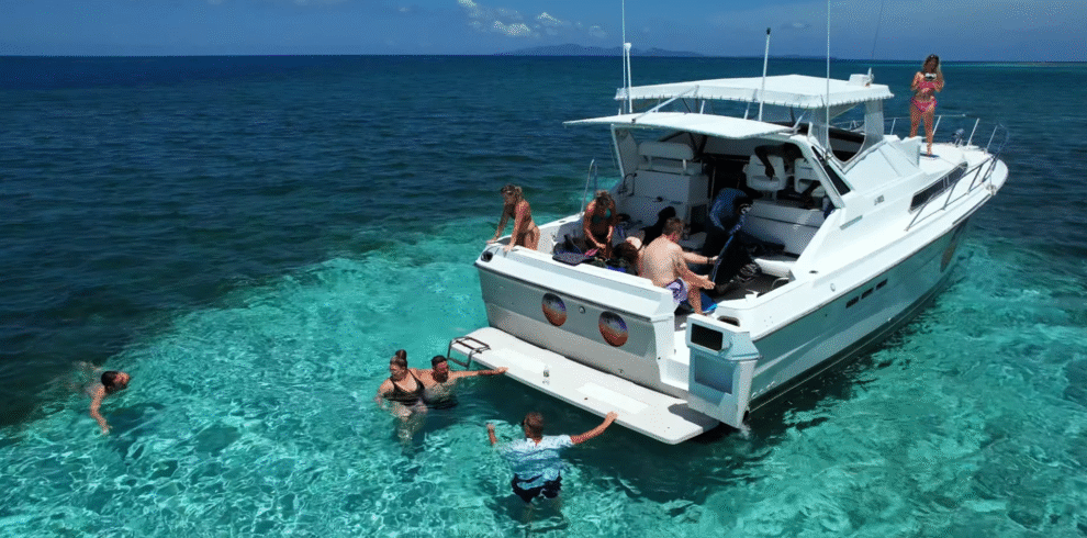 Private Pigeon Cay Tour Roatan luxury speedboat on turquoise water